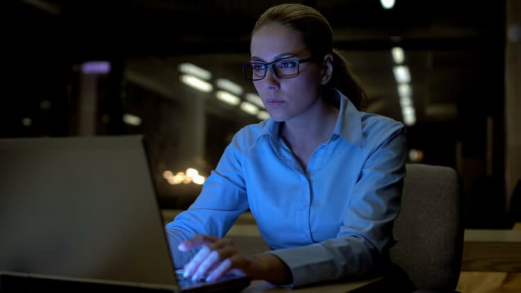 conscientious person looking at a laptop