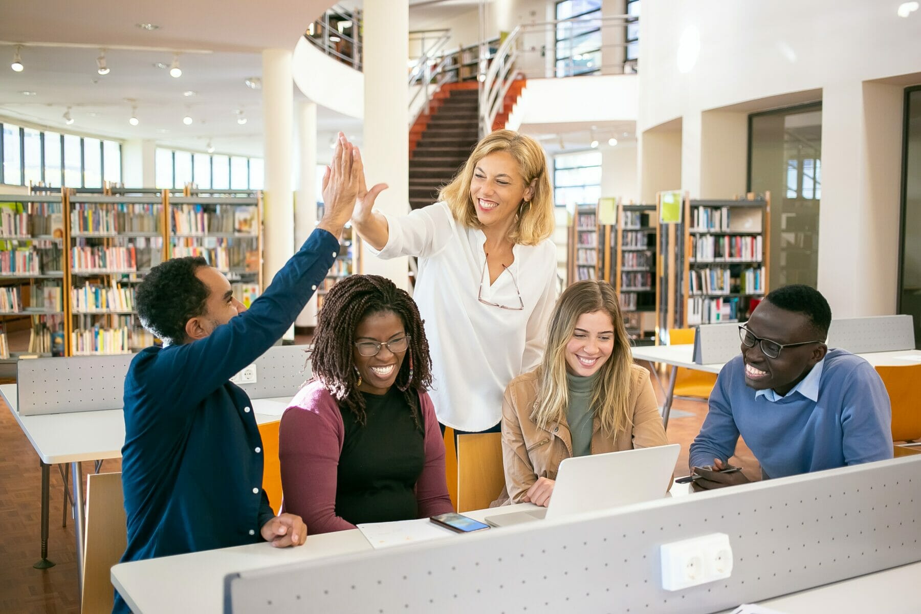 disc-personality-types-a-group-of-coworkers-engaging-in-a-library